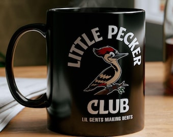 May include: Black coffee mug with a white design of a cartoon woodpecker and the text "Little Pecker Club Lil Gents Making Dents".