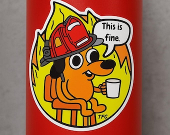 May include: A red water bottle with a sticker featuring a cartoon dog in a firefighter's helmet, sitting in a chair, holding a mug, and surrounded by flames. The speech bubble says, "This is fine."