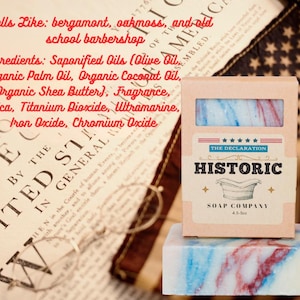 May include: A bar of soap with red, white, and blue swirls, packaged in a cardboard box. The box is labeled "Historic Soap Company" and features a vintage design. The soap is 4.5 oz.