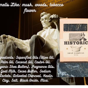 May include: A bar of soap in a box with the text "Lincoln Historic Soap Company" and an image of Abraham Lincoln. The soap smells like musk, woods, tobacco, and flower. The ingredients include saponified oils, goat milk, and activated charcoal.