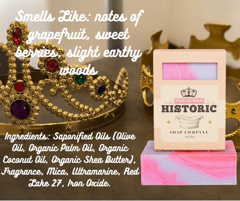 May include: A pink and purple swirled soap bar with a matching box from The Queen Historic Soap Company. The soap is on a pink and purple block. A gold crown is in the background. The soap smells like grapefruit, sweet berries, and earthy woods.