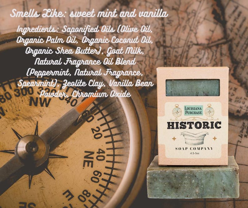 May include: A bar of green soap and its box from the Historic Soap Company, with the text "Louisiana Purchase" and "Historic" on the box. The soap smells like sweet mint and vanilla. A compass is in the background.