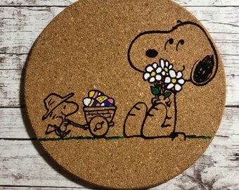 Snoopy Easter Coaster with Woodstock and wheelbarrow of Easter eggs. All Natural Absorbent Cork Coaster. Fun for kids to seniors.