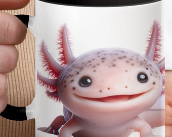 May include: A white ceramic mug with a black rim and handle features a colourful illustration of an axolotl with a friendly smile. The axolotl is pink with black spots and has feathery gills.