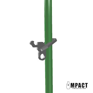 May include: A dark gray metal latch attached to a green post. The latch has a hook, a flat plate, and a circular opening. The post is a solid, vertical structure. The logo "IMPACT PRECISION" is in the bottom right corner.