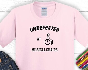 Undefeated at Musical Chairs Kids T-Shirt: Humorous Wheelchair Tee