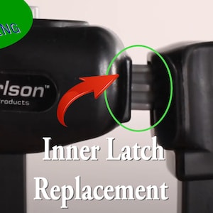 May include: Close-up of a black inner latch replacement for a Carlson Pet Products gate. The latch is made of plastic and has a metal pin. The latch is shown in the open position.