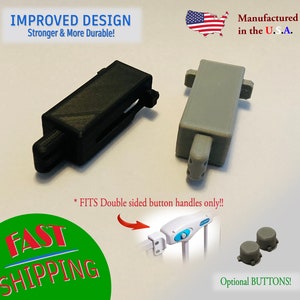 May include: Two plastic safety gate replacement parts, one black and one gray, with the text "IMPROVED DESIGN" and "Manufactured in the U.S.A." The image also includes the text "* FITS Double sided button handles only!!" and "Optional BUTTONS!"