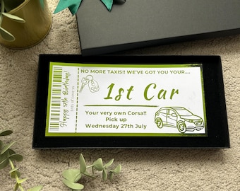 May include: A black and green ticket with the text "Happy 17th Birthday! Lots of Love xx" and "NO MORE TAXIS!! WE'VE GOT YOU YOUR.... 1st Car Your very own Corsa!! Pick up Wednesday 27th July".
