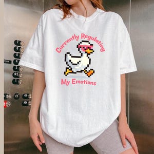 Maglietta Pixel Duck, animale in stile retrò 8-bit, maglietta per la sensibilizzazione sulla salute mentale