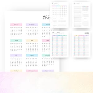 May include: A collection of pastel-colored 2026 and 2026 calendars and planners. The calendars feature monthly layouts with each month highlighted in a different pastel color. The planners include daily and yearly layouts.