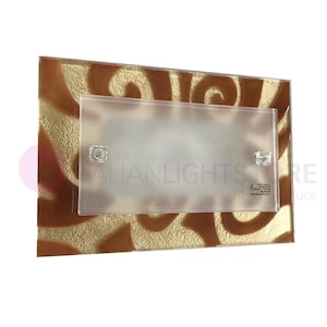 May include: A rectangular light switch cover with a frosted glass insert. The cover features a brown and gold swirl pattern.