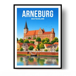 Op de afbeelding: Een ingelijste reisposter van de stad Arneburg, Deutschland. De illustratie toont een grote kerk met een hoge kerktoren en rode daken boven een rivier, met de tekst ARNEBURG DEUTSCHLAND in witte letters aan de bovenkant van de afbeelding.