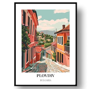 May include: A framed art print of Plovdiv, Bulgaria, featuring a colorful street scene. The artwork depicts buildings in shades of orange and red, with a cobblestone street leading into the distance. The text "Plovdiv Bulgaria" is at the bottom.