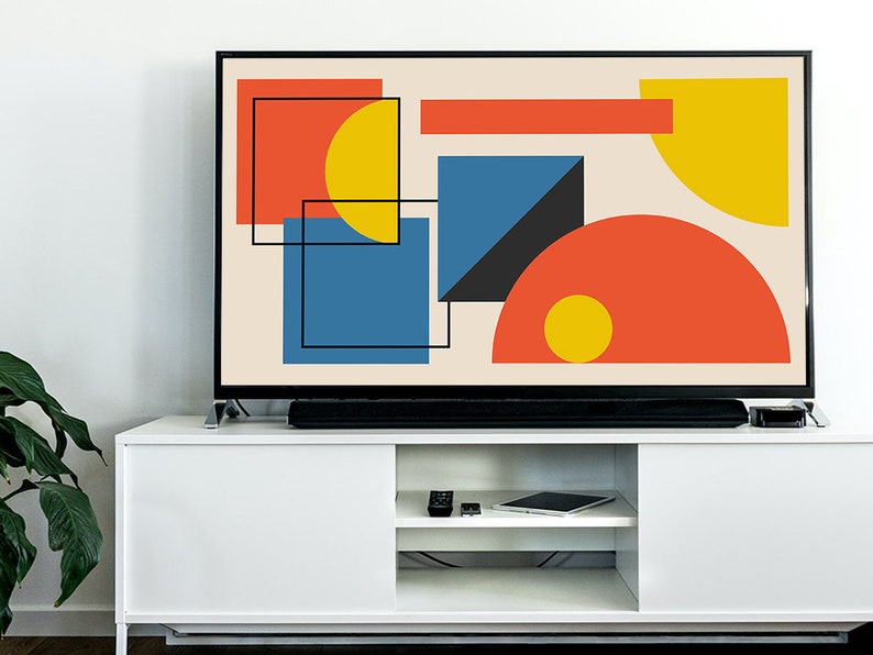 May include: A flat screen television with a geometric abstract design in shades of red, yellow, blue, and black on a cream background.