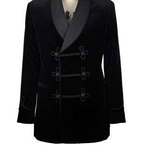 May include: A black velvet blazer with a satin shawl collar and decorative knot closures.