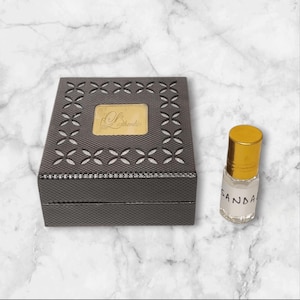 Sandalwood attar perfume oil, warm and sweet notes, perfect for men and women