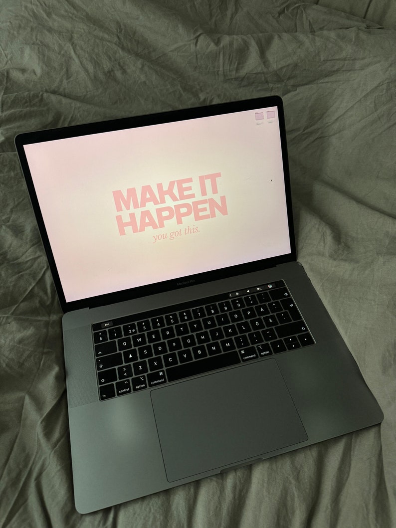 May include: A laptop computer with a motivational quote on the screen that reads "MAKE IT HAPPEN you got this."
