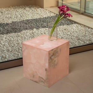 Minimalist pink onyx table in form of cube