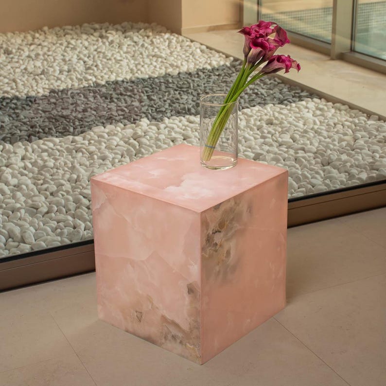 Minimalist pink onyx table in form of cube
