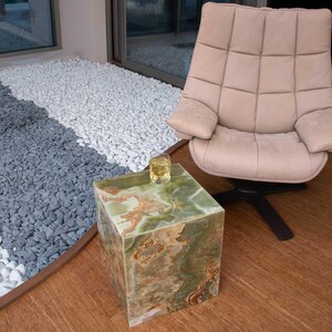 Stylish end table made of green onyx, featuring a cube structure