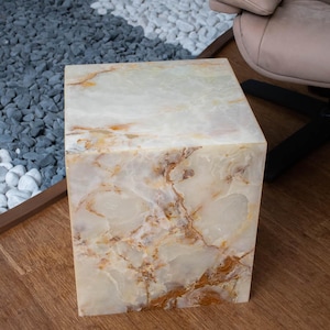 Natural white onyx stone table with square cube design for contemporary interior styling.
