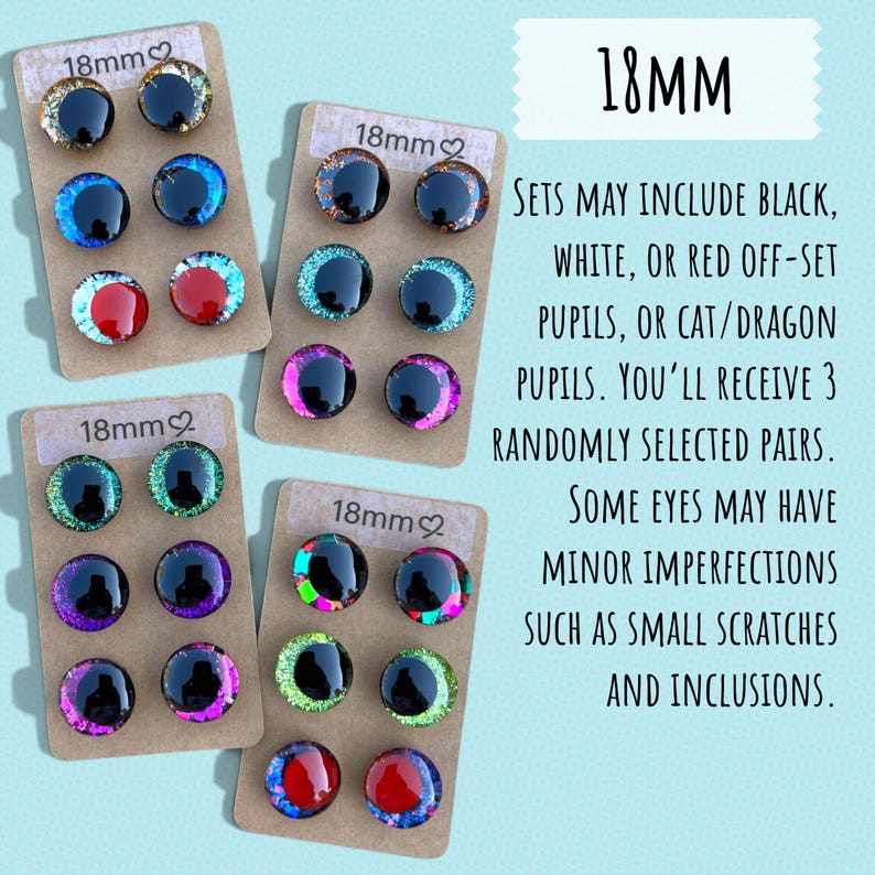 May include: Sets of 18mm craft eyes in various colors, including black, blue, red, and green, displayed on small cardboard cards. The text on the cards reads "18mm". The text on the right side of the image says "SETS MAY INCLUDE BLACK, WHITE, OR RED OFF-SET PUPILS, OR CAT/DRAGON PUPILS."