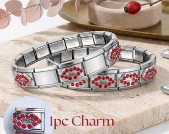 May include: A stainless steel link bracelet featuring multiple red crystal-encrusted lip charms. The individual links are marked stainless steel. A single matching lip charm is shown separately with the text 1pc Charm.