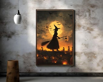 Op de afbeelding: Een ingelijst kunstwerk met Halloween-thema toont een heksensilhouet tegen een volle maan, met een lantaarn en bezem. Vleermuizen vliegen boven een veld met pompoenen. Het kleurenschema bevat tinten oranje, zwart en geel.