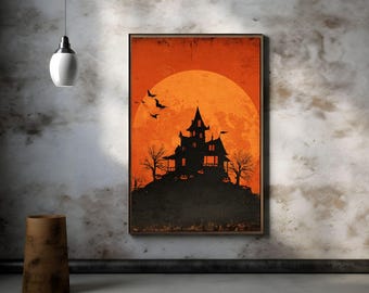 Op de afbeelding: Een ingelijste Halloween-print met een zwart silhouet van een spookhuis op een heuvel tegen een oranje zonsondergang. Vleermuizen vliegen in de lucht en kale bomen omlijsten het huis. De print heeft een vintage, distressed look.