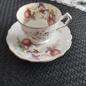 Vintage Aynsley Orchid design bone china saucer and teacup. Great condition item from estate.