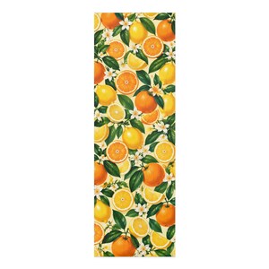May include: A rectangular fabric panel featuring a repeating botanical pattern of bright orange citrus fruits, yellow lemons, and white blossoms with deep green leaves. The design is densely packed with whole fruits and slices against a cream background.