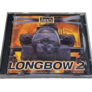 May include: A CD case for the computer game "Longbow 2" by Jane's Combat Simulations. The cover art shows a helicopter against a fiery backdrop. The game title is in large orange letters.