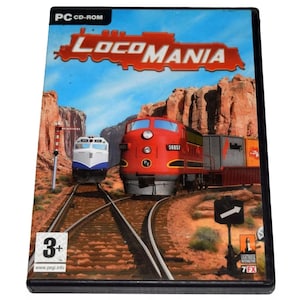 May include: A PC CD-ROM game case for LocoMania, a train simulation game. The cover features a red and white train with the game title in large, white letters. The background is a desert landscape with red rock formations.