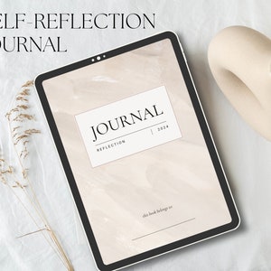 May include: A digital tablet displaying a journal cover with the text "JOURNAL" and "REFLECTION 2024". The tablet is black-framed and rests on a white surface, accompanied by a beige, abstract vase and dried floral stems. The words "SELF-REFLECTION JOURNAL" are at the top.