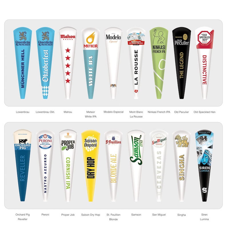 May include: A collection of seventeen tapered beer tap handles arranged in two rows. Each handle features distinct branding, including logos and text for various beer brands such as Lowenbrau, Mahou, Meteor, Modelo, Mont Blanc, Ninkasi, Old Peculier, Old Speckled Hen, Orchard Pig, Peroni, Proper Job, Saison, St. Feuillien, Samson, San Miguel, Singha, and Siren Lumina.