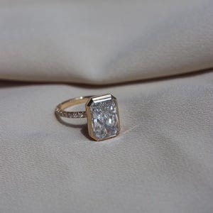 Bezel Set Radiant Cut Moissanite Ring: 14K Yellow Gold Solitaire