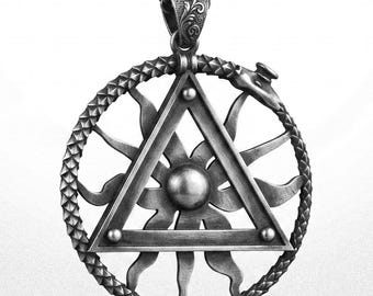 May include: A dark silver-toned pendant necklace featuring a circular Ouroboros snake design enclosing a sunburst motif and a central triangle. The pendant hangs from a matching link chain and displays intricate engraved details on the bail.