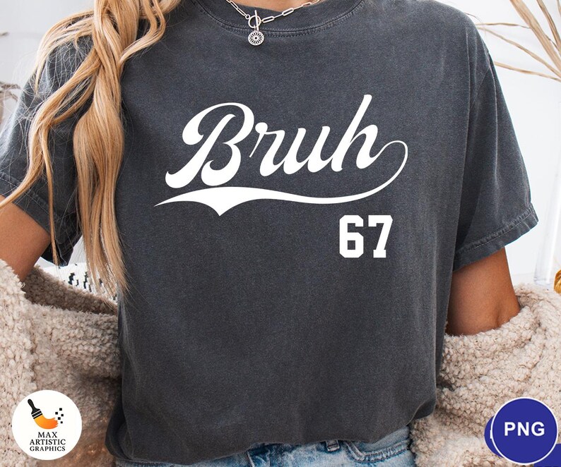May include: Dark gray t-shirt with the word "Bruh" in a white script font and the number "67" below it. The shirt has a vintage, slightly faded look.