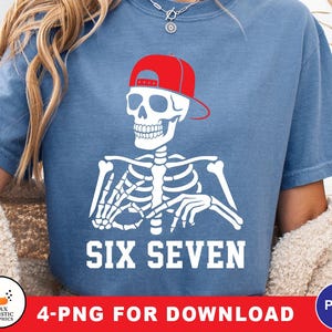 May include: A blue t-shirt featuring a white skeleton wearing a red baseball cap. The text "SIX SEVEN" is printed in white below the skeleton. The shirt is a casual style.
