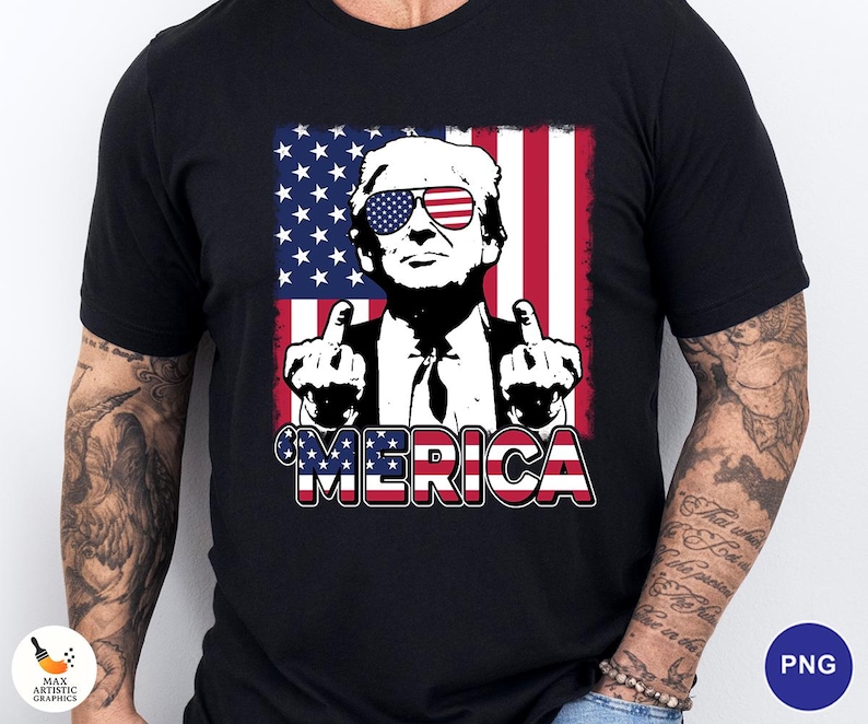 May include: Black t-shirt featuring a graphic of a man wearing sunglasses with the American flag design. The man is giving the middle finger with both hands. The word "MERICA" is written in red, white, and blue.