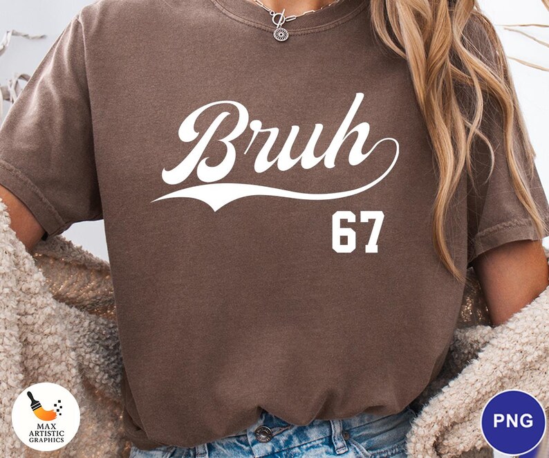 May include: A brown t-shirt with the word "Bruh" in white script and the number "67" below it. The shirt has a vintage, worn look.