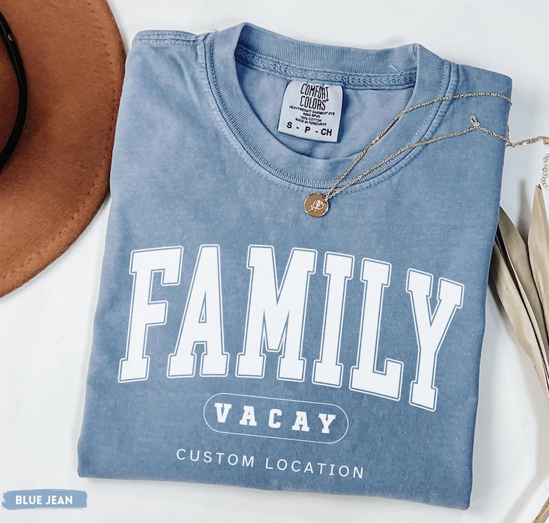 Comfort Colors shirt featuring a minimalist white varsity-style “Family Vacay” design with a customizable location underneath, perfect for matching family vacations and summer trips.
