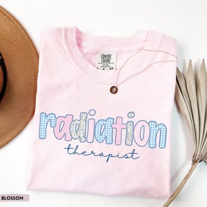 Floral radiation therapist shirt with retro medical design, perfect RT graduation gift for future radiation therapists and oncology professionals.
