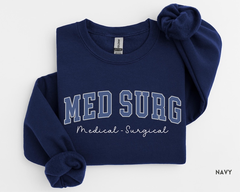 May include: Navy blue sweatshirt with the text "MED SURG" in a collegiate font, with "Medical - Surgical" below. The sweatshirt is a crew neck style.