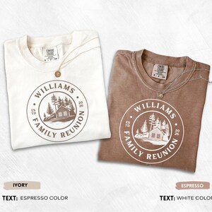 May include: Two short-sleeve t-shirts, one ivory with espresso-colored ink and one espresso with white ink. Both feature a circular graphic with a cabin, pine trees, and the text "WILLIAMS FAMILY REUNION ESTD 2026". Each shirt has a Comfort Colors label.