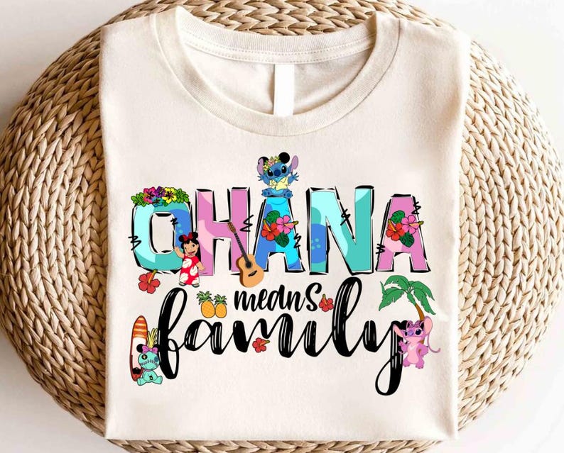 May include: A white t-shirt with a colorful graphic design featuring the text "Ohana means family" with Stitch and other characters from the Disney movie Lilo & Stitch.