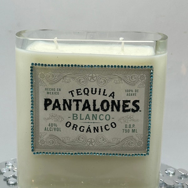 Pantalones Blanco Tequila 37 oz soy candle adorned by blue rhinestones, glitter name! Fresh coastal scent. Great gift or bar decor. 5”x5”x2”