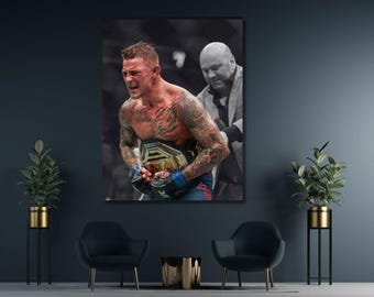 May include: A rectangular wall art print featuring a tattooed mixed martial arts fighter wearing black gloves and holding a gold championship belt, with a person in a suit standing behind them in a dimly lit arena setting with a dark background.