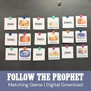 May include: A collection of white cards with colorful push pins, each featuring a name and an illustration. The cards are arranged on a dark surface. Text on the cards includes "Adam," "Moses," "Daniel," and "Noah." The phrase "Follow the Prophet" is at the bottom.